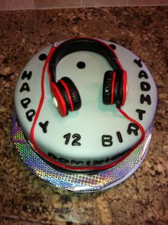 a birthday cake with headphones on it