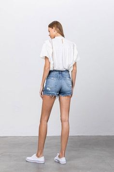 Button-Down Mid-Rise Denim Shorts Upgrade your summer wardrobe with our button-down mid-rise denim shorts. The classic denim look with a modern twist offers both style and comfort. Style: Casual Print/Pattern: Medium wash Denim Silhouette: Shorts Fit: Mid Rise - Regular Embellishment: Distressed edged Neck Line: N/A Sleeve: N/A Length: No Closure: Button Closure Lining: No Made In: CHINA Fabric Contents: 98% COTTON, 2% SPANDEX Stretch fabric Non-sheer fabric Care Instructions: Machine Wash Cold Farm Clothes, Ripped Denim Shorts, Mid Rise Shorts, Sleeveless Bodysuit, Ripped Denim, Mini Shorts, Floral Dress Black, Hoodie Top, S Models