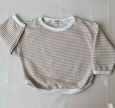 Oversized Ribbed Striped Tops, White Cotton Sweater With Horizontal Stripes, Oversized Striped Top For Layering, Oversized Tops With Contrast Stripes For Layering, Casual White Organic Cotton Sweater, Striped Cotton Sweater For Layering, Fall Tops With Contrast Stripes, Striped Cotton Sweater For Loungewear, Striped Oversized Cotton Sweatshirt