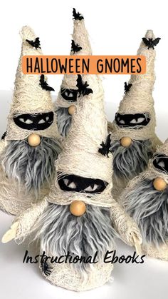 three halloween gnomes with bats on their heads