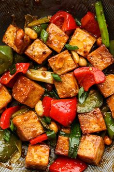 tofu and peppers stir fry in a wok