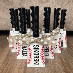 six baseball toothbrushes in a holder with burlocks and polka dot ribbon