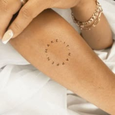 a woman's arm with the word love written on it in cursive font