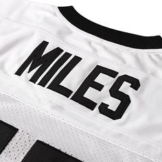 the front of a white and black football jersey with miles on it's chest