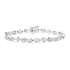 Exude an elegant vibe with the vintage-inspired details of this regal marquise-shaped multi-diamond line bracelet. Created in cool 10K white gold Marquise-shaped composites of round diamonds shimmer in rope-textured frames. Captivating with 3 cts. t.w. of diamonds This 7.0-inch bracelet secures with a box clasp. Classic Marquise Diamond Bracelet With Brilliant Cut, White Marquise Diamond Bracelet For Formal Occasions, Formal Marquise Diamond Bracelet With Diamond Accents, Formal Marquise Diamond Bracelet With Accents, Elegant Marquise Diamond Bracelet For Formal Occasions, Elegant Marquise Diamond White Tennis Bracelet, Elegant Marquise Diamond Tennis Bracelet, Classic Marquise Diamond Bracelet In White Gold, Elegant Marquise Tennis Bracelet For Anniversary