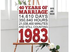 an easel with a sign that reads forty years of marriage and the date in red