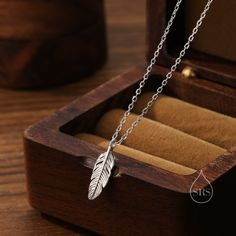 Tiny Feather Pendant Necklace in Sterling Silver, Wing Feather Necklace, Tiny Feather Necklace, Silver Feather Necklace Dimensions :  charm measures 10mm. 40+5cm long.  Materials and Care: These are made of sterling silver with the option of 18ct gold coating or 14ct Rose Gold Coating. Only precious metals are used and they are hypoallergenic. They are tarnish resistant but please keep in a sealed plastic bag when not wearing.  Stamp: 925 SRS ( our brand initials for Silver Rain Silver).  Packag Gold Feather Necklace, Silver Feather Necklace, Feather Pendant Necklace, Feather Necklace, Book Jewelry, Silver Wings, Feather Pendant, Silver Feather, Feather Necklaces