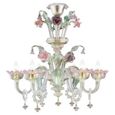 a glass chandelier with flowers and butterflies on it