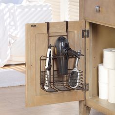 a wooden cabinet with two kitchen utensils in it