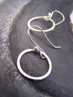 Silver Dainty Hammered Hoop Earrings, Dainty Hammered Silver Hoop Earrings, Small Hoop Sterling Silver Earrings With Lever Back, Adjustable Sterling Silver Hoop Earrings With Lever Back, Sterling Silver Circle Hoop Earrings With Ear Wire, Sterling Silver Hoop Earrings With Ear Wire, Simple Small Hoop Sterling Silver Earrings, Dainty Small Hoop Earrings In Sterling Silver, Simple Sterling Silver Hoop Jewelry