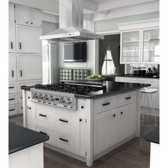 a kitchen with an oven, stove and counter tops in white painted wood flooring