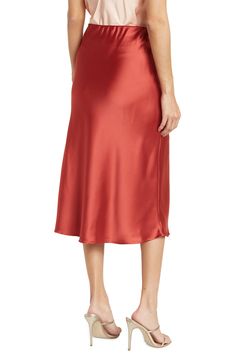 Elevate your wardrobe with this pull-on bias satin midi skirt for elegant, feminine style. 31" length (size S) Elasticized waist Pull-on style Satin construction 97% polyester, 3% spandex Machine wash cold, line dry Made in USA Model’s stats for sizing: 5’10” height, 34” bust, 27” waist, 35” hips. Model is wearing size S. Silk Midi Skirt With Bias Cut, Formal Knee-length Satin Skirt, Formal Satin Knee-length Skirt, Silk Bias Cut Midi Skirt, Relaxed Midi Skirt With Bias Cut, Sleek Satin Bottoms Midi Length, Sleek Satin Midi-length Bottoms, Sleek Satin Midi Bottoms, Satin Midi Bottoms For Evening