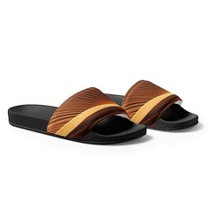 Introducing our Sand Desert Men's Slides, a perfect blend of style and comfort for the modern man. Crafted with meticulous attention to detail, these slides effortlessly combine the rugged charm of the desert with a contemporary design. Ideal for casual outings or lounging by the pool, our Sand Desert Men's Slides are a must-have addition to your footwear collection. Shop now and experience the ultimate comfort and style that our slides have to offer. Men's Slides Product Details:• Strap Comfort Brown Casual Slippers For Vacation, Brown Slides With Cushioned Footbed, Brown Casual Slides For Vacation, Casual Brown Slides For Outdoor, Casual Brown Outdoor Slides, Casual Brown Slides For Vacation, Brown Slides For Vacation, Brown Slide Slippers With Textured Footbed, Casual Brown Outdoor Slippers