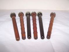 five different types of wooden grips on a white sheet