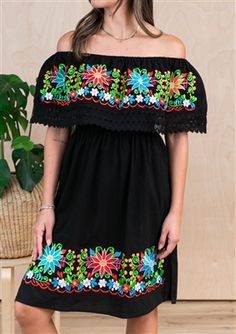 Black Peasant Dress For Summer, Traditional Black Spring Dresses, Black Folk Style Beach Dress, Black Peasant Dress For Spring, Black Dress With Embroidered Hem For Vacation, Black Floral Embroidered Beach Dress, Beach Black Embroidered Dress With Floral Details, Black Folk Embroidered Summer Dress, Black Floral Embroidered Dress For Beach