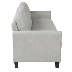 a gray couch sitting on top of a white floor