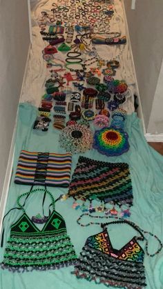 an assortment of beaded items are laid out on the floor next to each other