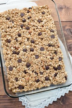 a glass baking dish filled with granola and chocolate chips