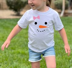 Our snowgirl toddler shirt will look great on your little one during the Christmas holiday or on your next snow day! Also available in Onesies® sizes newborn-24 months at https://www.etsy.com/listing/1089866922/snowman-onesies-for-babys-1st-christmas?click_key=88fdced251eed4bf21e04559355628871cb468d1%3A1089866922&click_sum=62f839f7&ref=shop_home_active_8 We offer sizes 2T, 3T, 4T, and 5T for all shirt designs.  If you are looking for a baby Onesies® be sure to check out the rest of our shop as s Spring Shirts Vinyl, Girl Snowman, Winter Holiday Outfits, Snowman Shirt, Kid Christmas, Christmas Toddler, Girl Holiday, Snow Girl, Snowman Faces