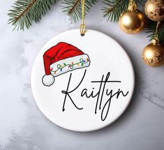 personalized christmas ornament with santa hat on it