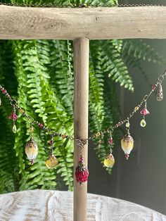 Beautiful Lampwork flower necklace.  I have been gather a variety of gorgous Lampwork floral bead from around the world and have started to create some jewelry out of them. This necklace has beautiful red berry focal point.  I used glass work flower beads, Swarovski bicone beads and peridot and yellow Chalcedon gemstones in this magical necklace.    It comes on a 20  chain.  Such a whimsical spring summer necklace! Whimsical Red Flower Jewelry, Bohemian Czech Glass Flower Jewelry, Whimsical Red Beaded Jewelry, Red Beaded Whimsical Jewelry, Red Bohemian Flower Pendant Jewelry, Bohemian Red Flower Pendant Jewelry, Handmade Glass Flower Necklace, Bohemian Necklace With Flower Charm And Round Beads, Bohemian Red Jewelry With Flower Decoration