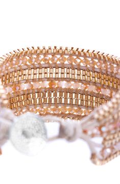 a close up of a bracelet on a white background