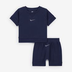 Get ready to help littles get set for fun with this 2-piece set, made of soft cotton rib knit fabric that stretches for freedom of movement. The tee has a tagless crewneck for a comfy feel and venting at the hem adds extra breathability. The matching shorts have a comfy stretch waistband and ribbed cuffs to provide a secure fit as they move. Sporty Crew Neck Playwear Set, Blue Sporty Crew Neck Set, Navy Ribbed Cotton Top, Navy Cotton Loungewear Sets, Playful Sports Cotton Sets, Ribbed Cotton T-shirt For Loungewear, Nike Cotton Playtime Sets, Cotton Athleisure T-shirt For Playwear, Sportswear Loungewear Sets With Crew Neck