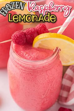 raspberry lemonade smoothie in a mason jar with strawberries and lemons