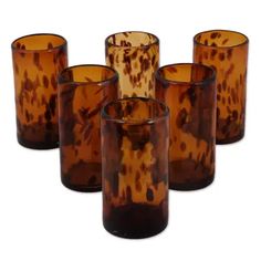 six brown glass vases sitting next to each other