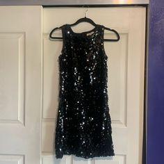 Black Sequin, Sleeveless Mini Dress. Bought For A Costume Party And Was Never Worn. Black Sleeveless Dress For Party Season Night Out, Black Sleeveless Dress For Party Season, Black Sleeveless Dress For Date Night Party, Black Sleeveless Dress For Date Night, Sleeveless Mini Dress For Holiday Party, Glamorous Black Sleeveless Dress For Party Season, Black Sleeveless Sequin Dress For Summer, Black Sleeveless Dress With Sequins For Summer, Black Sequined Sleeveless Evening Dress