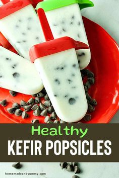 healthy kefir popsicles on a red plate with sunflower seeds in the background