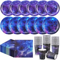 purple and blue space themed party supplies including plates, cups, napkins and napkins