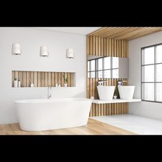 a large white bath tub sitting in a bathroom next to a sink and window with wooden slats on the wall