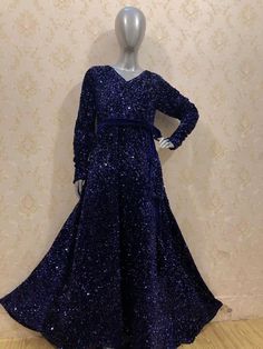 "This is a gorgeous sequin velvet stretchable maxi dress with full sleeves. It comes with a belt. Total flair is 140 inches all around. Length of the dress is 55 inches. Sizes available are  Small (chest 36\") Medium (chest 40\") Large (chest 44\")" Embellished Floor-length Winter Dresses, Winter Embellished Floor-length Dress, Winter Floor-length Embellished Dresses, Festive Floor-length Sequin Evening Dress Fabric, Winter Sequin Floor-length Dress, Winter Floor-length Sequin Dress, Festive Long Sleeve Sequin Maxi Dress, Glamorous Floor-length Velvet Gown, Glamorous Velvet Floor-length Gown