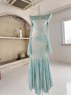 This enchanting dress features an elegant off-shoulder fold-over neckline, adding a touch of sophistication to any occasion. The fabric is adorned with delicate floral patterns, beautifully blending shades of blue and green for a refreshing and graceful look. The mermaid silhouette is expertly crafted with curved tailoring, allowing the skirt to flow gracefully with every step, exuding an air of refined elegance.  Please note that the price includes one dress only.   	 		 			Size 			XS 			S 			M Shades Of Blue And Green, Enchanting Dress, Mermaid Silhouette, Mermaid Skirt, Skirt Dress, Floral Patterns, Blue And Green, Shades Of Blue, Mint Green