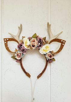 This Deer Headband is whimsical and romantic! The headband itself is a hard plastic headband wrapped in caramel brown yarn, the antlers look like real antlers.  An array of purple, cream, and blue  flowers and leaves form a crown. Large ivory pearls are nestled between the flowers. Tiny gold flowers and purple succulents can also be found between the larger flowers. The ears are made out of felt with white faux fur insides and pearls at the tips. The macramé  cords at the bottom to help secure t Whimsical Crown Headpiece With Matching Headband, Whimsical Crown-shaped Headpiece With Matching Headband, Whimsical Adjustable Headband For Wedding, Whimsical Headband Hair Accessories, Whimsical Adjustable Headband For Gifts, Whimsical Adjustable Headband For Gift, Adjustable Brown Headband Headpiece, Adjustable Brown Headband, Adjustable Whimsical Headpiece As Gift