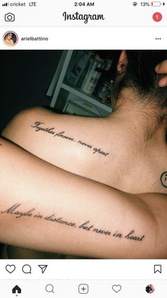 two people with matching tattoos on their backs