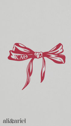 an image of a red bow with the word kao on it's side