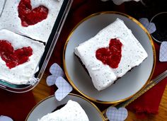 two plates with desserts on them and hearts in the middle