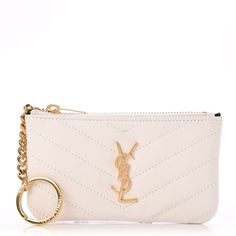 This Is An Authentic Saint Laurent Calfskin Matelasse Monogram Key Pouch In Porcellana. This Chic Modern Key Pouch Is Finely Crafted Of Smooth Off White Calfskin Leather. This Key Pouch Features A Brass Ysl Logo On The Front And A Brass Zipper Pull That Opens To A Black Fabric Interior With A Attached Key Ring For The Everyday Small Essentials With The Chic Style Of Saint Laurent! Size Base Length: 5.25 In Height: 3.00 In Width: 0.50 In Good Condition! Comes With Dustbag, Black Cards, & Box! Dad Christmas Gifts, Bags Ysl, Black Cards, Ysl Saint Laurent, Ysl Logo, Saint Laurent Bags, Key Pouch, Yves Saint Laurent Bags, Christmas Gift For Dad