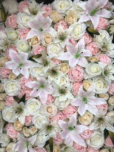 white and pink flowers are arranged together