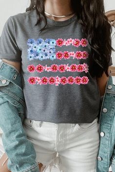 Flower USA Flag Graphic T-shirt. Unisex Crew Neck Short Sleeves 100%COTTON HEATHER(52%COTTON,48%POLY) ATH.HEATHER,BLACK HEATHER(90%COTTON,10%POLY) Imported Size Measurement (inch): S: 36.0 (Bust), 18.0 (Waist), 18.0 (Hips), 28.0 (Length) M: 40.0 (Bust), 20.0 (Waist), 20.0 (Hips), 29.0 (Length) L: 44.0 (Bust), 22.0 (Waist), 22.0 (Hips), 30.0 (Length) XL: 48.0 (Bust), 24.0 (Waist), 24.0 (Hips), 31.0 (Length) Spring Gray Graphic Tee T-shirt, Spring Gray T-shirt With Letter Print, Spring Gray Letter Print T-shirt, Multicolor Flag Print Casual T-shirt, American Flag Print Short Sleeve Top For Spring, Gray Graphic Tee For Spring, American Flag Print T-shirt For Spring, American Flag Print Crew Neck Top For Spring, Spring American Flag Print Relaxed T-shirt