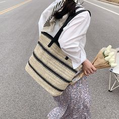 Step into summery outings with our Striped Summer Straw Bag – a stylish blend of fashion and functionality. Crafted with precision using straw weaving, it offers a lightweight and trendy feel. The interior features a sleek polyester lining for durability and a smooth finish. Size up your summer style with dimensions of 16.1" (Upper Width), 13" (Lower Width), 13" (Height), and 3.9" (Thickness). The adjustable shoulder strap extends to 25.2" for versatile wear. Choose your vibe with different stri Straw Weaving, Stylish Tote Bag, Line Texture, Straw Bags, Straw Tote, Summer Look, Natural Look, Summer Looks, Summer Style