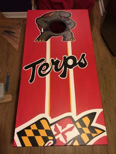 a cornhole board with the word terps painted on it