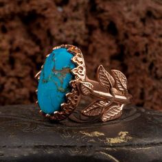 Turquoise Flower Rose Gold Plated Silver Women Ring. Handmade in 925 gold color plating sterling silver with turquoise stone. On the ring Oval Turquoise - Feroza stone settled. At sides, flower figure settled with micro detailed ornament. Dimensions of stone is 20 mm x 15 mm. Average weight of Turquoise Flower Rose Gold Plated Silver Women Ring is 9 gr. (depends on your ring size). Back side is open and stone touches your skin. Classic and exclusive style. Stone Type: Turquoise - Feroza Stone Co Luxury Turquoise Ring As A Gift, Bohemian Rose Gold Gemstone Jewelry, Bohemian Rose Gold Ring Jewelry, Nature-inspired Turquoise Gemstone Jewelry, Luxury Gold Turquoise Ring Perfect For Gift, Luxury Gold Turquoise Ring As Gift, Luxury Gold Turquoise Ring For Gift, Luxury Gold Turquoise Ring, Luxury Handmade Turquoise Ring For Gift