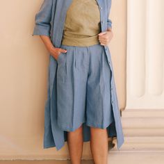 The Bermuda linen shorts prove you can be comfortable and smart on warm days. Designed in a wide-leg silhouette, these pleated shorts with pockets are sophisticated enough to style with a shirt, a blazer, or even a simple tank top.   DETAILS ⚬ Pleated front. ⚬ Adjustable elastic back waistband. ⚬ Zipper and button closure. ⚬ Side and back pockets are decorated with handmade stitches. ⚬ Made of washed organic Oeko-Tex certified linen. ⚬ Linen is NOT see-through.  FIT / SIZE ⚬ Designed for a slightly loose fit. ⚬ Adjustable waistband.  MODEL'S MEASUREMENTS ⚬ The model is wearing a size XS. ⚬ The model's height is 5'6" (167 cm). ⚬ The model's measurements are Bust 32¾" (83 cm); Waist 29" (73.5 cm); Hips 36¼" (92 cm). ⚬ FREE WORLDWIDE SHIPPING CARE ⚬ Wash on gently, up to 40 degrees. ⚬ Dry on Casual Bermuda Shorts With Built-in Shorts For Daywear, High-waisted Linen Shorts For Daywear, Linen Bottoms With Built-in Shorts For Daywear, Blue Linen Shorts For Day Out, Relaxed Fit Bermuda Bottoms For Day Out, Knee-length Shorts For Loungewear, Knee-length Bottoms With Built-in Shorts For Vacation, Relaxed Fit Knee-length Bermuda Shorts With Elastic Waistband, Knee-length Bermuda Shorts For Spring