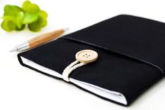 a notebook with a button on the cover