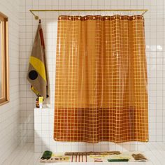 Sun Shower in Honey 2x2 front view of curtain hanging in a bathroom. Canvas Curtains, Orange Curtains, Vinyl Plastic, Shower Curtain Liner, Mirror With Hooks, Grid Style, Media Cabinet, Wall Accessories, Bed Desk