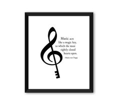 a black and white poster with a treble on it's side that says music is like a magic key, to which the most highly closed hearts open