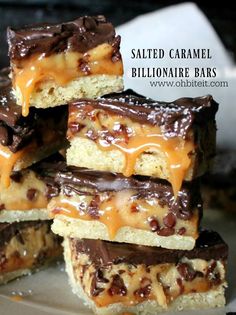 salted caramel blondie bars stacked on top of each other with chocolate drizzle